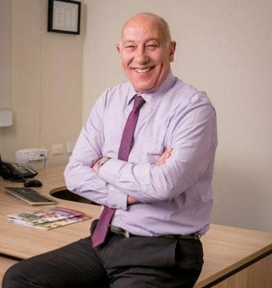 H. Vassila smiling for a picture